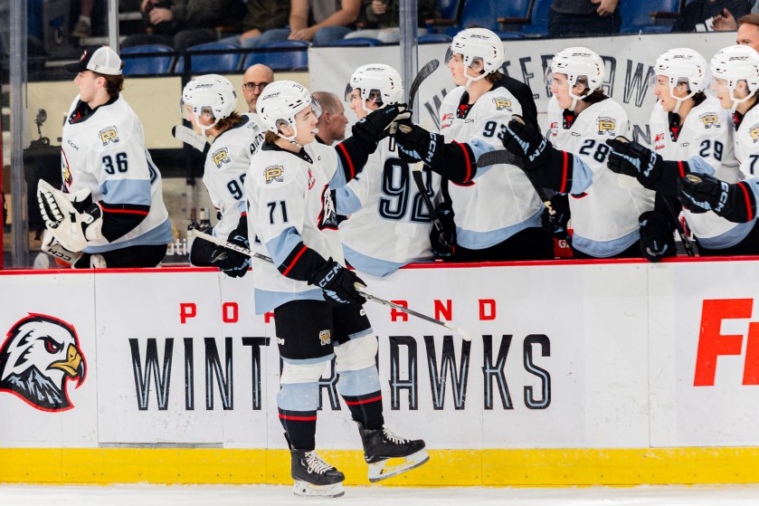 Josh Davies fist bumps his teammates after scoring a goal. Photo credit: Kyle Smutzki
