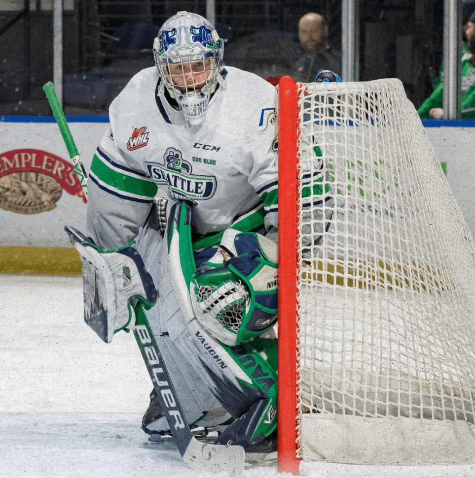Spencer Michnik hugging the post; Photo Credit: Seattle Thunderbirds